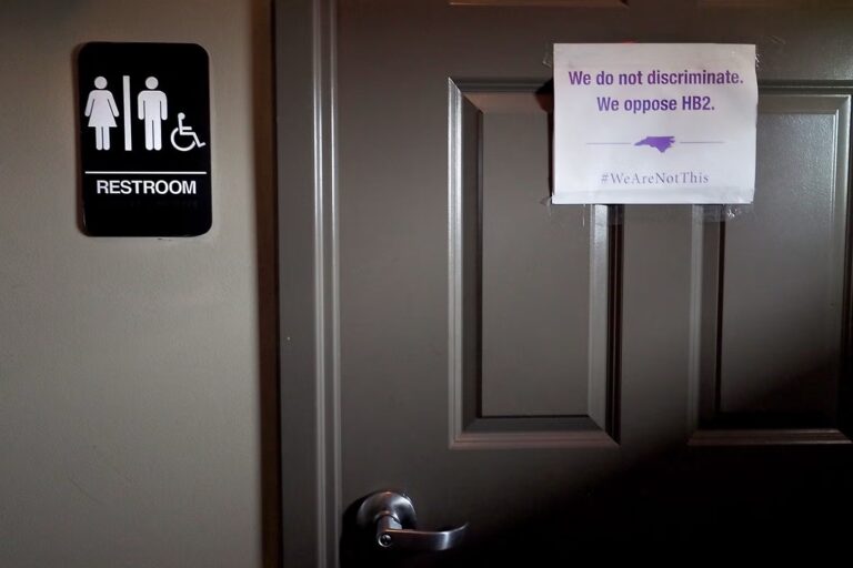 A unisex sign and the “We Are Not This” slogan outside a bathroom at Bull McCabe’s Irish Pub in 2016 in Durham, North Carolina. Sara D. Davis:Getty Images