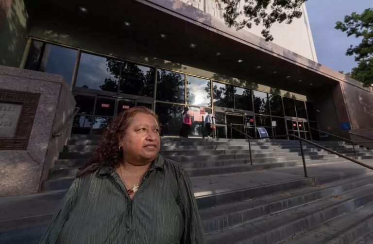 Alcira Ayala stands outside the Stanley Mosk Courthouse, credit Brian van der Brug, Los Angeles Times