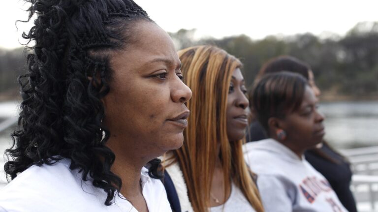 Angela Williams (left) with friends Lecoya Kelley and Shajuana Jackson , credit SYLVESTER FOLKS