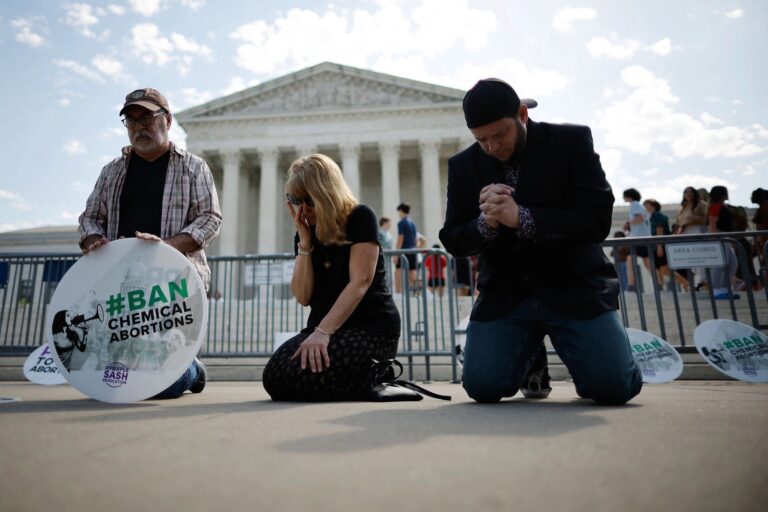 Anti-abortion activists pray in front of the Supreme Court on April 21, 2023, credit Chip Somodevilla:Getty Images