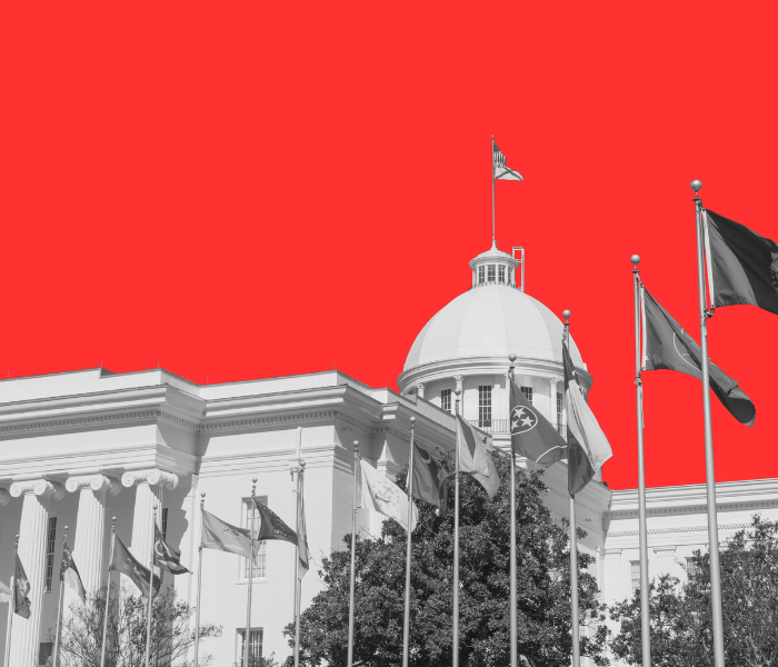 Black and white Alabama state house with red background