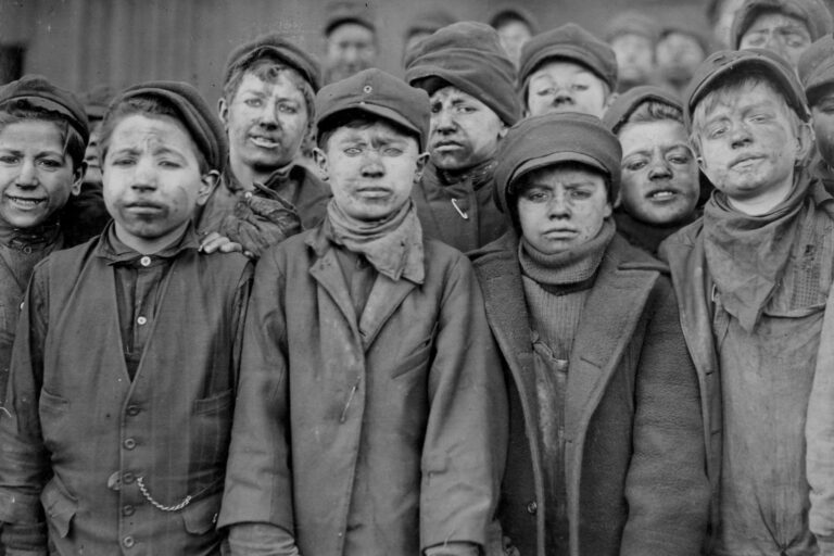 Group portrait of boys working in #9 Breaker Pennsylvania Coal Company, Pittston, Pennsylvania, in 1908, credit Lewis W. Hine, Buyenlarge, Getty Images