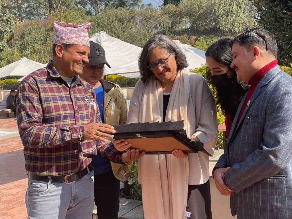 Human rights lawyer Agnieszka Fryszmanaccepts a plaque from villagers in Nepal, credit Washington Post