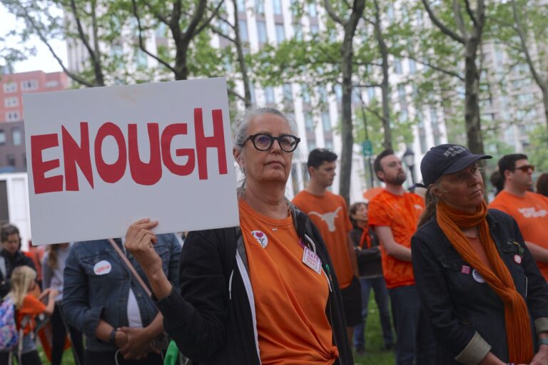Hundreds of people wear orange and march across Brooklyn Bridge in recognition of National Gun Violence Awareness Day on, June 3, 2023, credit Selcuk Acar, Anadolu Agency, Getty Images