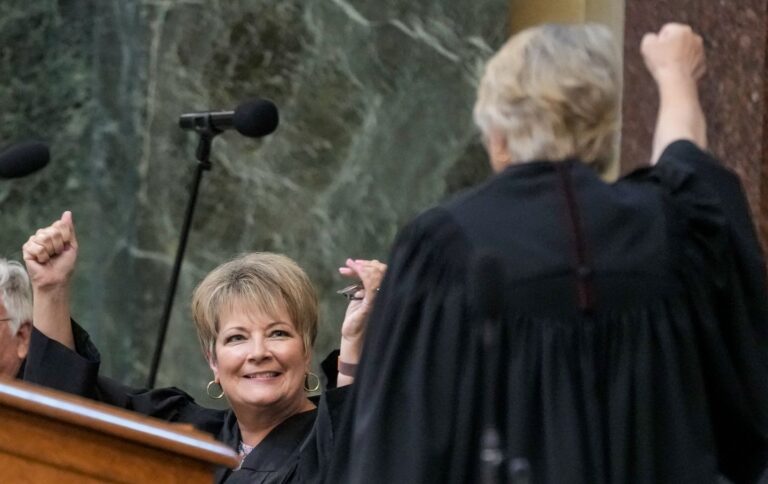 Janet Protasiewicz, left, celebrates with Supreme Court Justice Ann Walsh Bradley before being sworn in as a Wisconsin Supreme Court justice, credit Morry Gash, AP