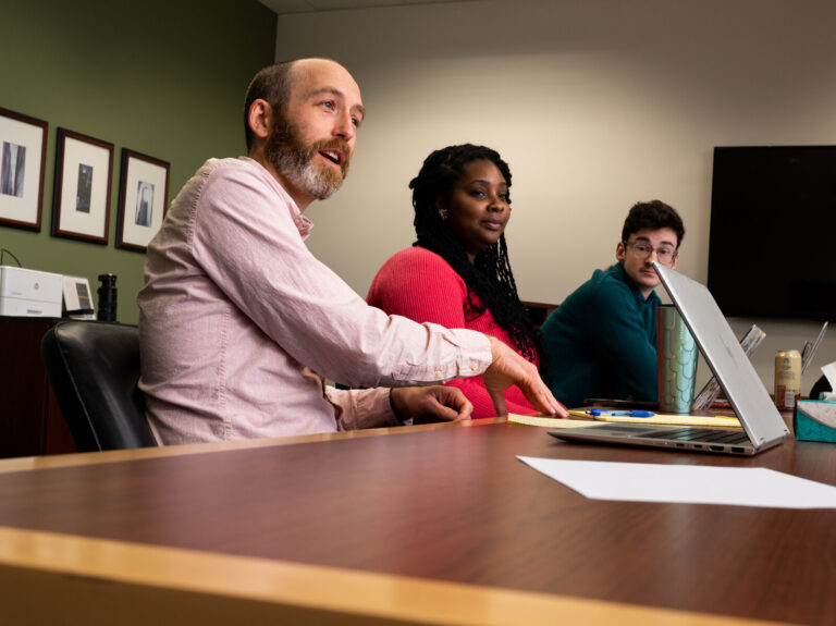 Justin Simard meets with students to discuss an ongoing citation project that highlights citations based on slavery.