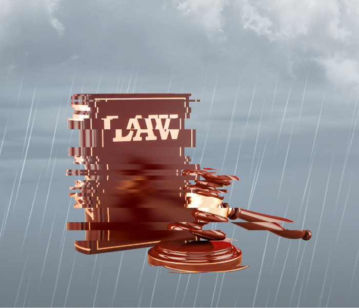 Law gavel being torn apart over stormy skies