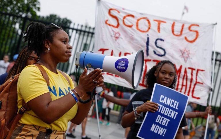 Student debt relief activists in a chant in front of the White House, credit Anna Moneymaker and Getty